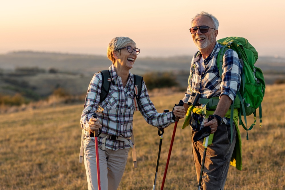 A retired couple hiking.