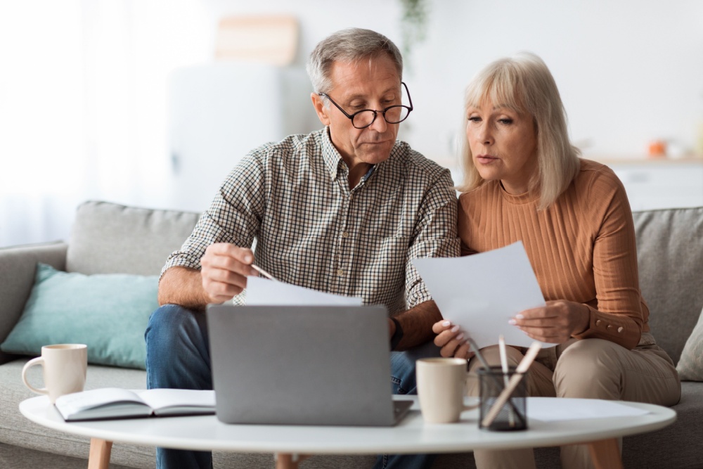 A couple reviewing paperwork together.