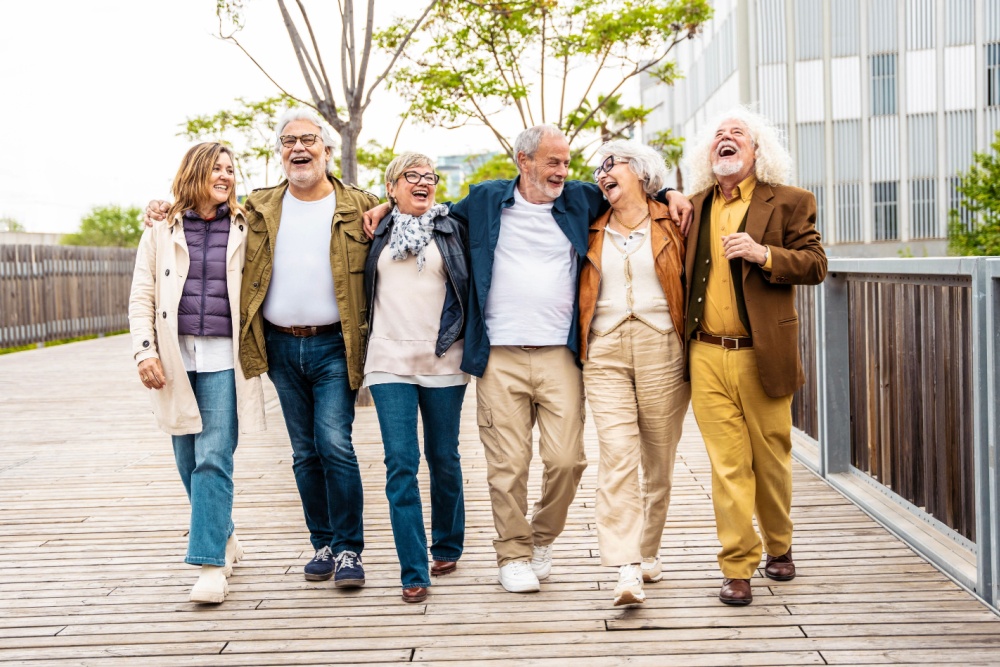 A group of people walking together and laughing.