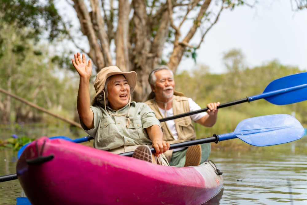 An older couple kayaking.