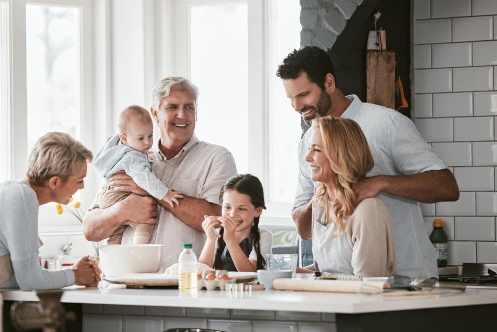 Three generations of family cooking in the kitchen